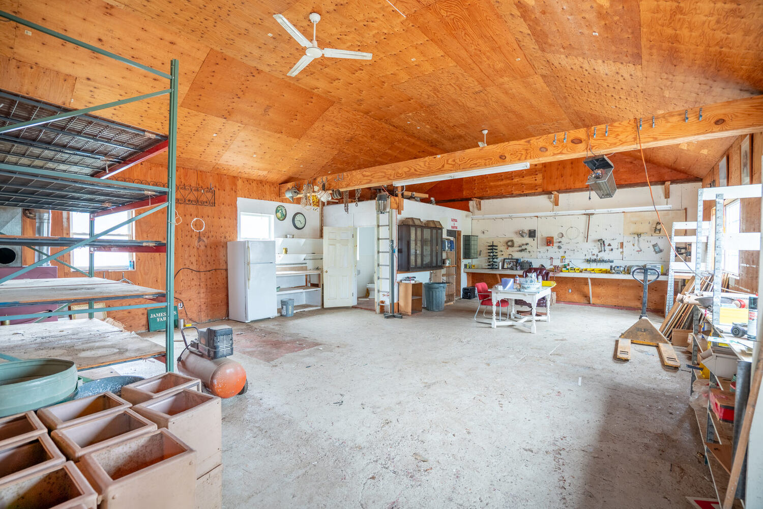 Workshop interior of Building 1 with workbench and storage