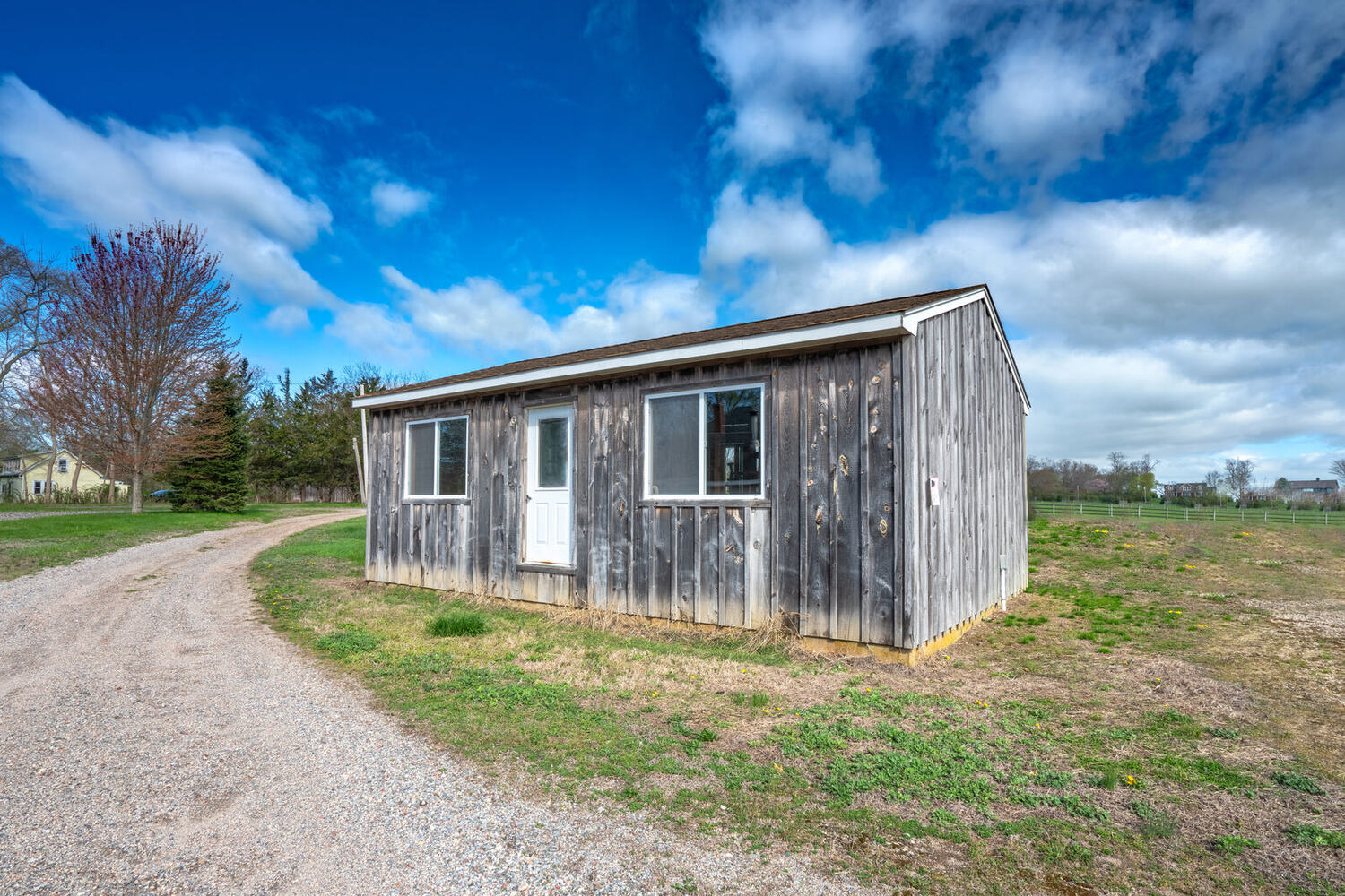 The weathered storage shed on the lawn