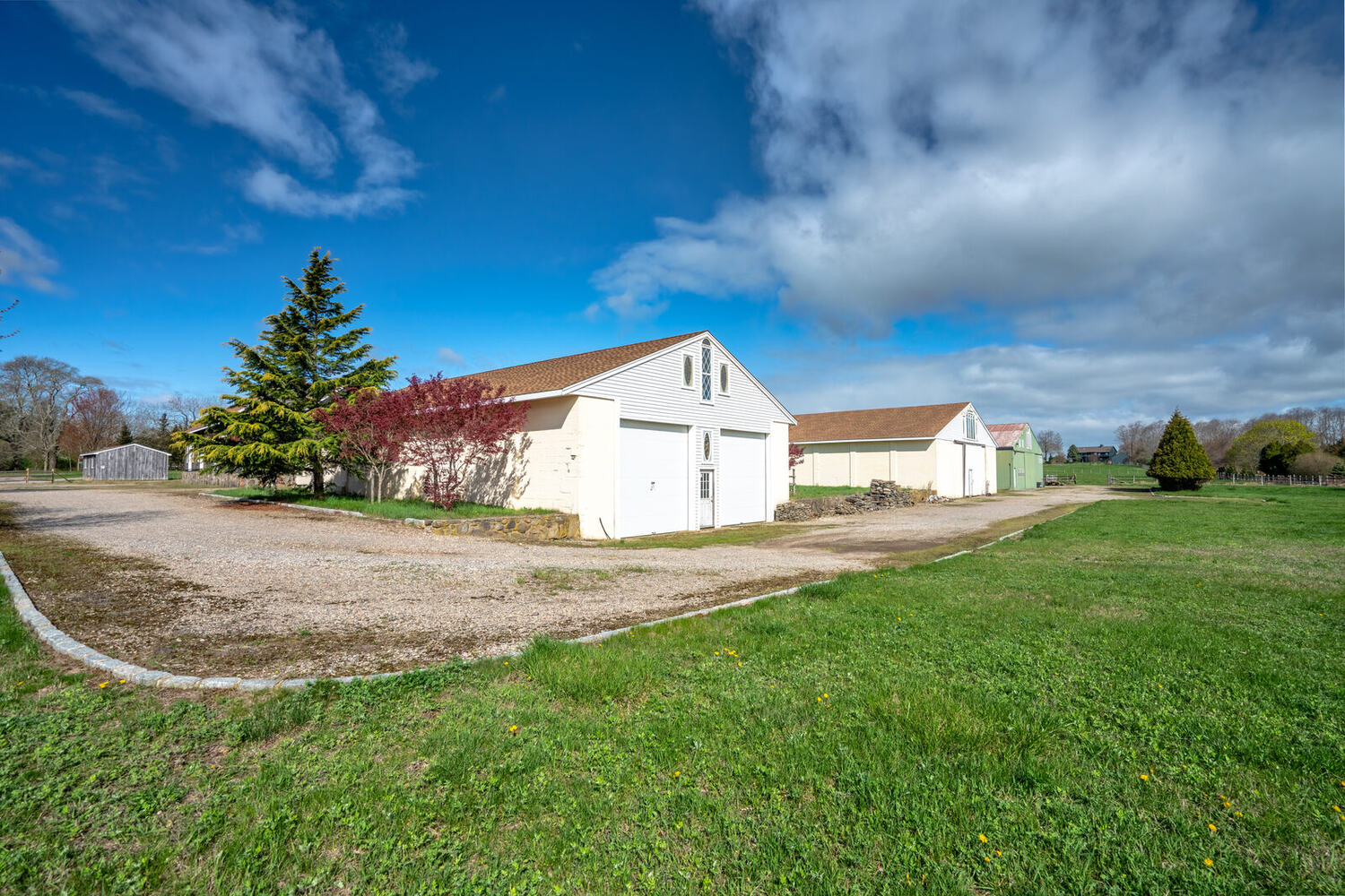 Exterior of the riding arena across the lawn