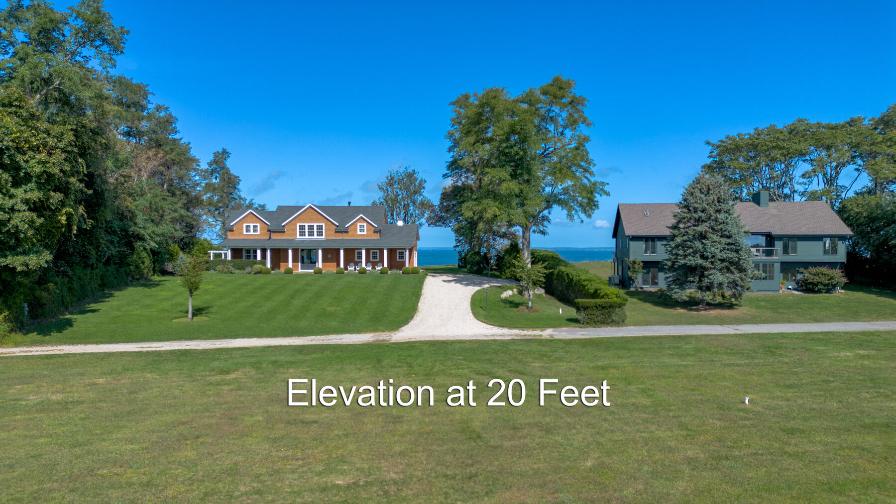 View from 20 feet of elevation showing nearby homes by the Sound